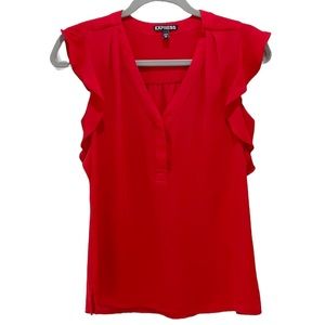 Red blouse with ruffle sleeves.